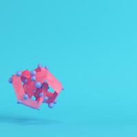 Pink abstract low poly shape on bright blue background in pastel colors photo