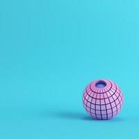Abstract segmented pink sphere on bright blue background in pastel colors photo