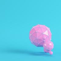 Pink low poly abstract spheres on bright blue background in pastel colors photo