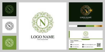 diseño de plantilla de logotipo de marco de mandala o flor de adorno de lujo de letra n con tarjeta de visita. vector