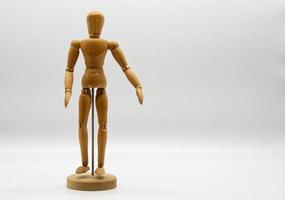 Wooden figure isolated on white background. Wood Figure Mannequin. Space for text. photo