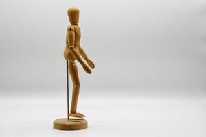 Wooden figure isolated on white background. Wood Figure Mannequin. Space for text. photo