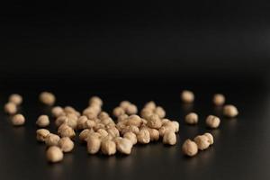 chickpeas on black background photo