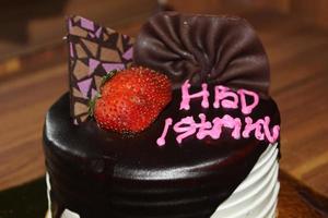 Birthday cake with Indonesian text language HBD Istriku, which means Happy birthday my wife photo