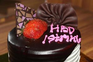 Birthday cake with Indonesian text language HBD Istriku, which means Happy birthday my wife photo