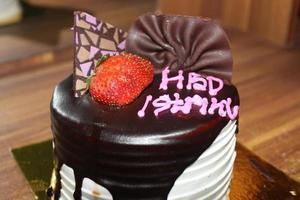 Birthday cake with Indonesian text language HBD Istriku, which means Happy birthday my wife photo
