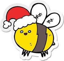 pegatina de una linda abeja de dibujos animados con sombrero de navidad vector