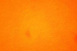 Orange abstract background texture. Blank for design, dark orange edges photo