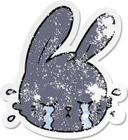 distressed sticker of a cartoon rabbit face crying vector