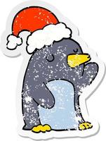 distressed sticker of a cute cartoon christmas penguin vector