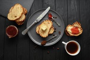 Continental Breakfast meal served with coffee, toast, jam and butter. Delicious coffee table. photo
