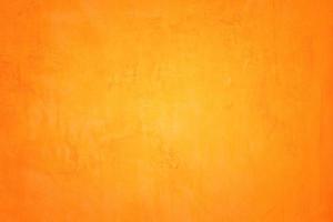 Orange abstract background texture. Blank for design, dark orange edges photo