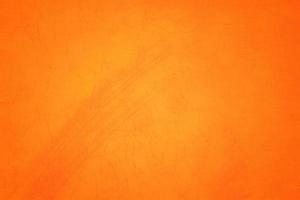 Orange abstract background texture. Blank for design, dark orange edges photo