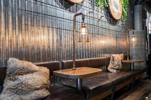 Illuminated tables with sofa in Espresso House at famous capital city photo