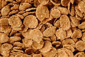 Crispy healthy dry cereal flakes as a background texture photo