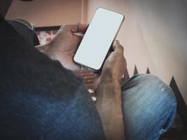 Mockup white screen cell phone. hand people man holding using mobile phone with blank screen mock up background for advertise marketing business. Concept marketing on smartphone. photo