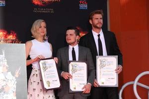 LOS ANGELES, OCT 31 -  Jennifer Lawrence, Josh Hutcherson, Liam Hemsworth at the Hunger Games Handprint and Footprint Ceremony at the TCL Chinese Theater on October 31, 2015 in Los Angeles, CA photo