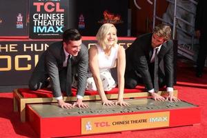 LOS ANGELES, OCT 31 -  Josh Hutcherson, Jennifer Lawrence, Liam Hemsworth at the Hunger Games Handprint and Footprint Ceremony at the TCL Chinese Theater on October 31, 2015 in Los Angeles, CA photo