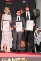 LOS ANGELES, OCT 31 -  Josh Hutcherson, Jennifer Lawrence, Liam Hemsworth at the Hunger Games Handprint and Footprint Ceremony at the TCL Chinese Theater on October 31, 2015 in Los Angeles, CA photo