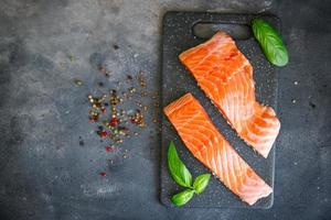 salmon raw seafood fresh healthy meal food snack diet on the table copy space food background rustic top view keto or paleo pescatarian diet photo