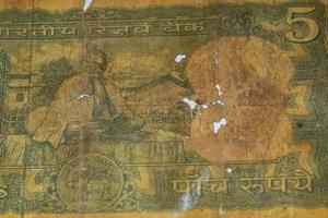 Rare Old Five Rupee notes combined on the table, India money on the rotating table. Old Indian Currency notes on a rotating table, Indian Currency on the table photo