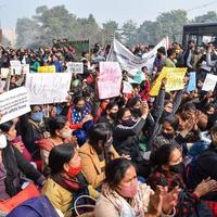 New Delhi, India December 25 2021 - Delhi Contractual Guest Teachers with posters, flags and graffitis protesting against Delhi AAP Government for making policy, Delhi Guest Teachers protesting photo