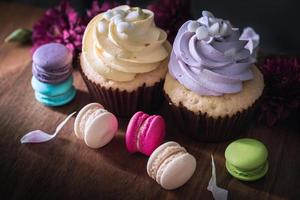 macarons or macaroons and cupcakes on wooden dessert sweet beautiful to eat photo