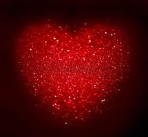 Red Blur heart shape of ligth bokeh on a black background photo