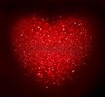 Red Blur heart shape of ligth bokeh on a black background photo