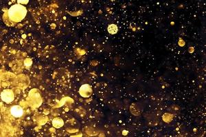Golden glitter bokeh lighting texture Blurred abstract background for birthday, anniversary, wedding, new year eve or Christmas photo