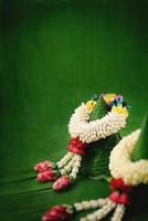 Thai traditional jasmine garland.symbol of Mother's day in thailand on Banana leaf photo