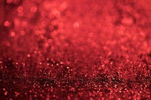 red glitter bokeh lights Blurred abstract background for Valentines, birthday, anniversary, wedding, new year and Christmas photo