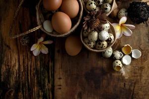 quail eggs on a vintage wooden background photo