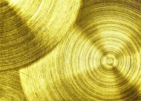 un hierro de metal dorado con fondo de textura circular foto