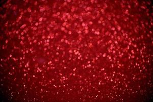 red glitter bokeh lights Blurred abstract background for Valentines, birthday, anniversary, wedding, new year and Christmas photo