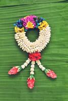 Thai traditional jasmine garland.symbol of Mother's day in thailand on Banana leaf photo
