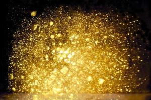 Golden glitter bokeh lighting texture Blurred abstract background for birthday, anniversary, wedding, new year eve or Christmas photo