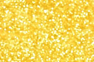 Golden glitter bokeh lighting texture Blurred abstract background for birthday, anniversary, wedding, new year eve or Christmas photo