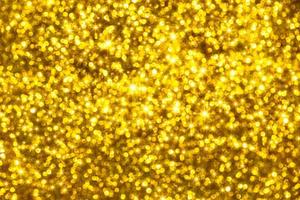 Golden glitter bokeh lighting texture Blurred abstract background for birthday, anniversary, wedding, new year eve or Christmas photo