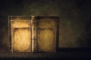 old books vintage on wood floor and paper aged background or texture photo