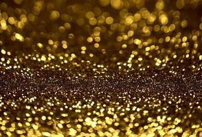 Golden glitter bokeh lighting texture Blurred abstract background for birthday, anniversary, wedding, new year eve or Christmas photo