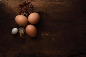 quail eggs on a vintage wooden background photo