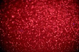 red glitter bokeh lights Blurred abstract background for Valentines, birthday, anniversary, wedding, new year and Christmas photo