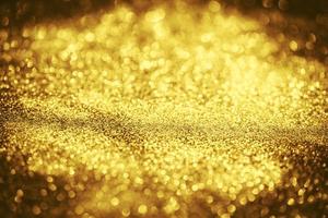 Golden glitter bokeh lighting texture Blurred abstract background for birthday, anniversary, wedding, new year eve or Christmas photo