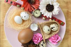 quail eggs in the nest on dish photo