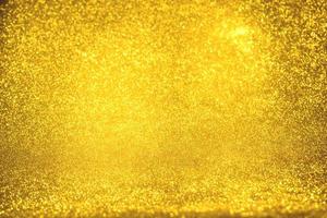 Golden glitter bokeh lighting texture Blurred abstract background for birthday, anniversary, wedding, new year eve or Christmas photo