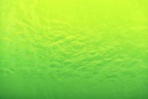 Waving water surface background in the pool. photo