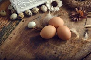 quail eggs on a vintage wooden background photo