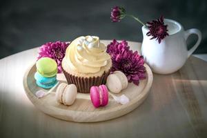 macarons or macaroons and cupcakes on wooden dessert sweet beautiful to eat photo