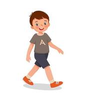 cute little boy walking on the road vector